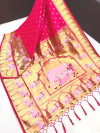 Rani pink color Paithani silk saree with zari weaving work