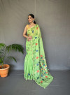Parrot green color linen silk saree with woven design