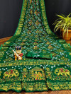 Green color pure hand bandhej silk saree with zari weaving work