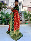 Red and bottle green color soft bandhej silk saree with zari weaving work