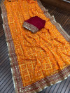 Yellow color georgette saree with bandhej printed work