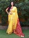 Yellow color bandhani silk saree with hand bandhej work