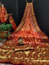 Orange and maroon color soft Bandhej silk saree with zari weaving work