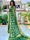 Dark green color soft bandhej silk saree with zari weaving work