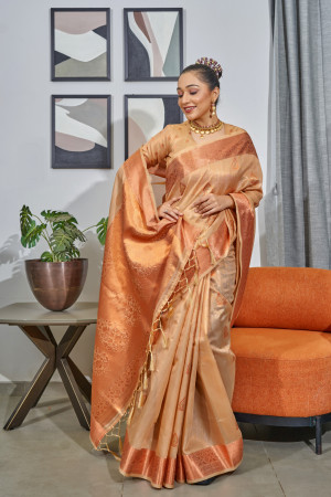 Beige color tissue silk saree with zari weaving work
