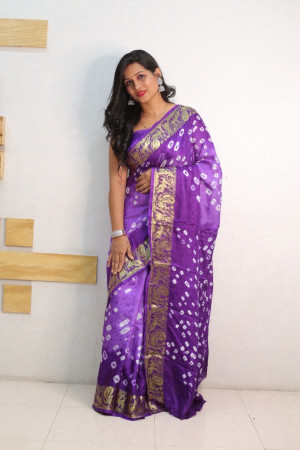 Lavender and purple color bandhej silk saree with zari weaving work