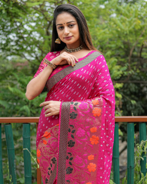 Rani pink color bandhej silk saree with woven design