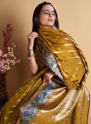 Mustard yellow color kanchipuram silk saree with zari weaving work