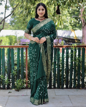 Dark green color pure hand bandhej silk saree with printed work