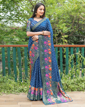 Rama green color bandhej silk saree with woven design