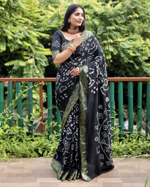 Black color pure hand bandhej silk saree with printed work
