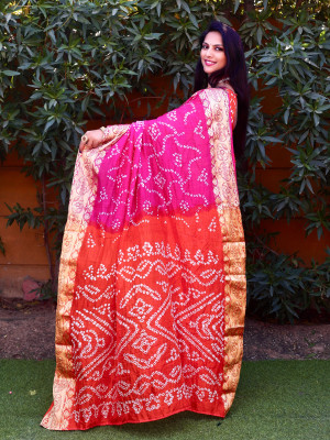 Rani pink color bandhani silk saree with hand bandhej work