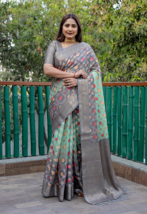 Pista green color linen silk saree with zari weaving work