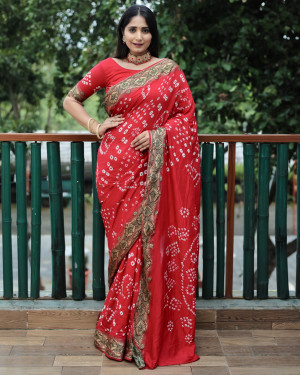 Red color pure hand bandhej silk saree with printed work