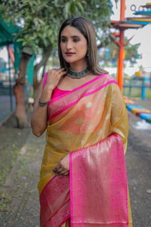 Yellow color tissue silk saree with zari weaving work