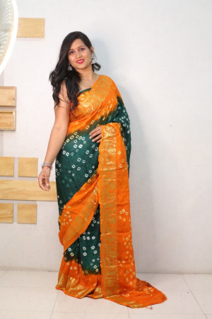 Green and orange color bandhej silk saree with zari weaving work