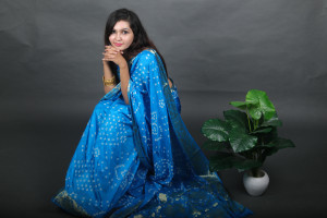 Sky blue color bandhej silk saree with zari weaving work