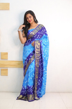 Sky blue and blue color bandhej silk saree with zari weaving work