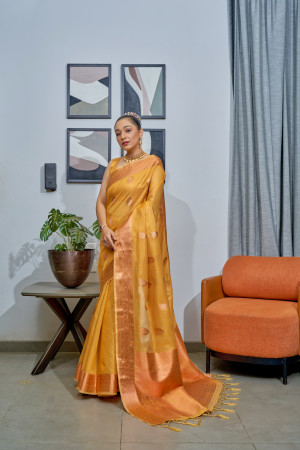 Mustard yellow color tissue silk saree with zari weaving work
