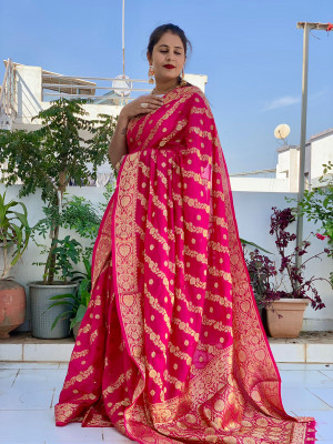 Rani pink color soft bandhej silk saree with zari weaving work