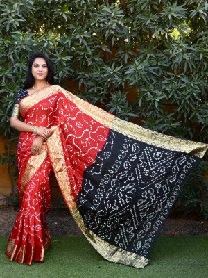 Red color bandhani silk saree with hand bandhej work