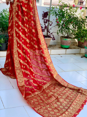 Red color soft bandhej silk saree with zari weaving work