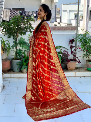 Orange and maroon color soft bandhej silk saree with zari weaving work