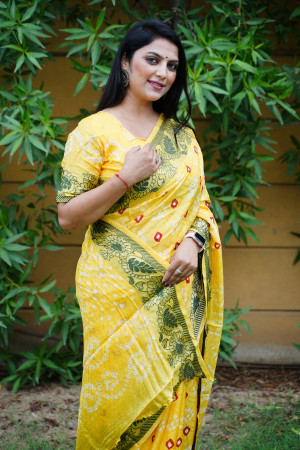 Yellow color bandhej silk saree with zari weaving work
