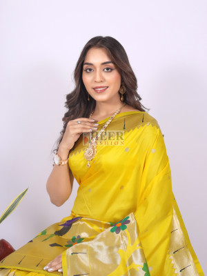 Yellow color paithani silk saree with zari weaving work