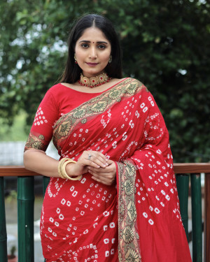 Red color pure hand bandhej silk saree with printed work