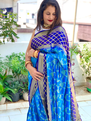 Firoji and royal blue color soft bandhej silk saree with zari weaving work