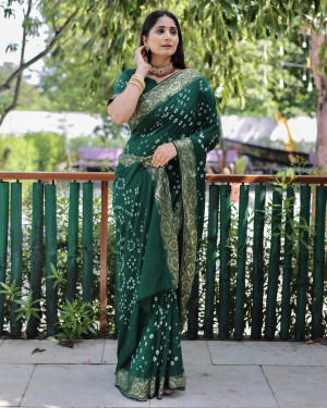 Dark green color pure hand bandhej silk saree with printed work