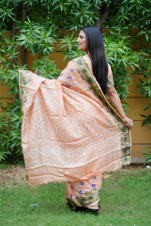Peach color bandhej silk saree with zari weaving work