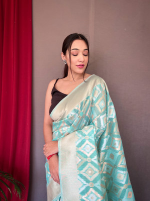 Sea green color linen silk saree with zari weaving work