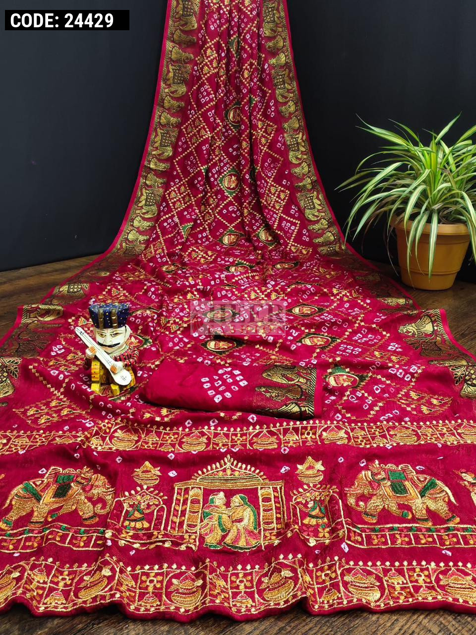 Rani pink color pure hand bandhej silk saree with zari