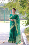 Rama green color soft linen silk saree with jamdani woven design