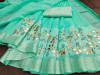 Sea green color linen cotton saree with embroidered work