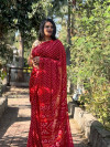 Red color dola silk saree with bandhej printed work