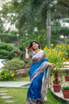 Blue color tussar silk saree with madhubani printed work