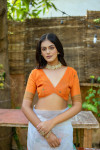 Orange color soft muga cotton saree with floral weaving work