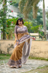Beige color tussar silk saree with madhubani printed work