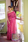 Pink color tussar silk saree with Leheriya printed work