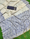 Off white and navy blue color soft muga cotton saree with jamdani woven design
