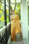 Yellow color tussar silk saree with printed work