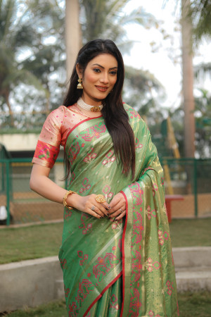 Green color soft organza silk saree with patola woven design