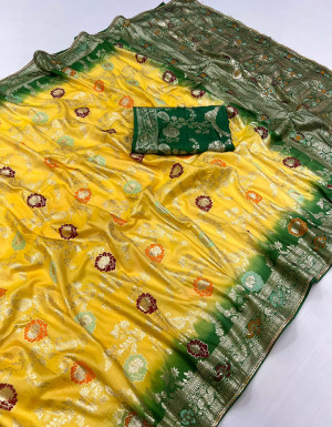 Yellow and green color dola silk saree with zari weaving work