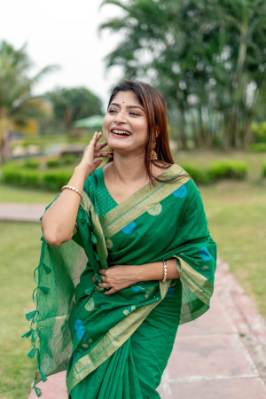 Green color soft linen silk saree with jamdani woven design