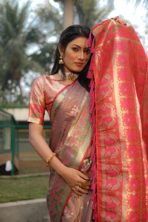 Dusty pink color soft organza silk saree with patola woven design