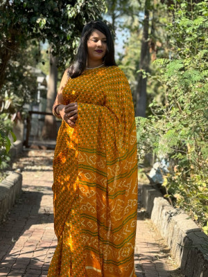 Yellow color dola silk saree with bandhej printed work