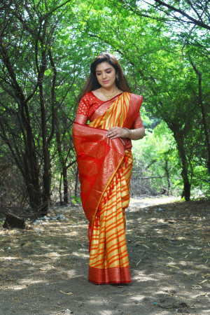 Yellow color soft leheriya silk saree with zari weaving work